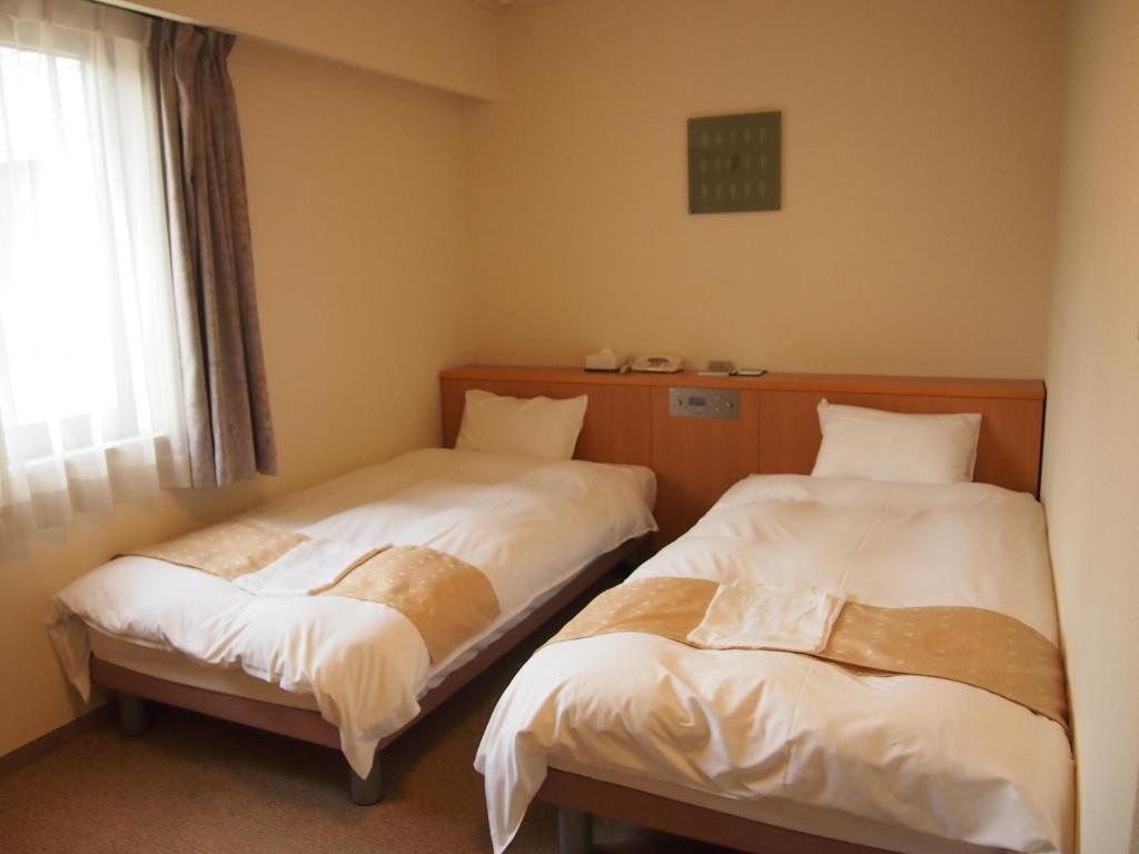 Nest Hotel Kumamoto Quarto foto